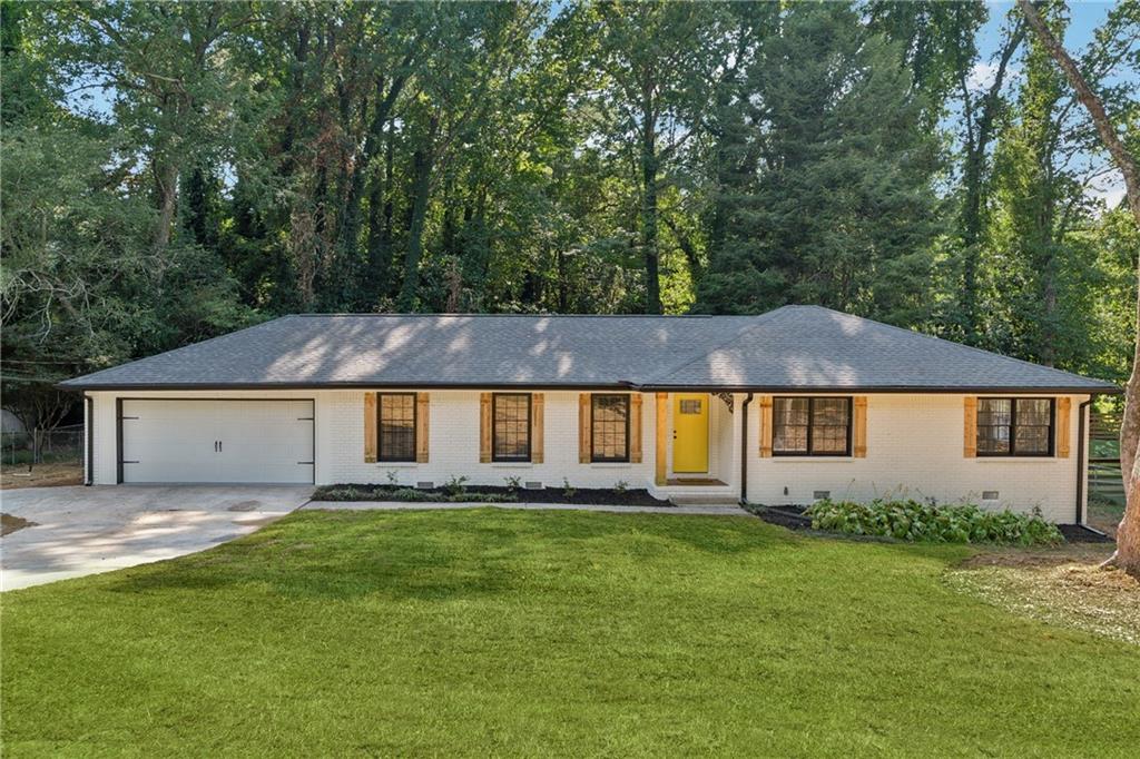 Fully Renovated ranch in prime location! Located in the highly desirable Brookwood School Cluster, this stunning 4-bedroom, 2-bath ranch has been completely transformed with modern upgrades and timeless style. Just minutes from Scenic Highway, you’ll enjoy easy access to endless shopping, dining, and entertainment options. Step inside to discover an open-concept layout with brand-new hardwood floors, a sleek quartz waterfall island, and a stylish electric fireplace that creates the perfect centerpiece for gatherings. Both bathrooms have been beautifully renovated, complementing the home’s fresh, modern feel. Additional updates include a new A/C unit, new water heater, and fresh interior and exterior paint, ensuring true move-in readiness. This home combines prime location, top-rated schools, and a complete renovation—making it a rare find you don’t want to miss!