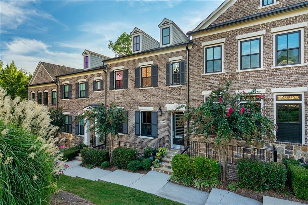 Stunning Brookhaven Townhome – Luxury Living Meets Unbeatable Location! This 3-level Brookhaven beauty offers 3 bedrooms, 3.5 bathrooms, a convenient elevator, and thoughtful upgrades—including a brand-new HVAC system—all wrapped into one exceptional home. The main level impresses with soaring 10-foot ceilings, rich hardwood floors, and an entertainer’s dream chef’s kitchen with an oversized island. The living room showcases custom built-ins, a cozy fireplace, and triple full-view French doors leading to a veranda with private greenery views—a seamless blend of indoor and outdoor living. Upstairs, retreat to your owner’s suite with dual tray ceilings, spa-like en suite bathroom, and walk-in closet. A guest bedroom overlooks the waterfall garden, which doubles as a cozy fire pit area in winter. A second full bathroom and laundry room complete this level. The lower level, with its 9-foot ceilings, includes a spacious third bedroom with full bath, currently designed as a home gym but easily convertible into a guest suite or office. Throughout the home, you’ll find 9-foot ceilings on the upper and lower levels, 8-foot doors, and elegant design details that elevate the space. Additional highlights include a two-car garage with built-in storage, private rear access, additional carport and access to a sparkling community pool. Prime Location! Just steps from the new Brookhaven City Center, CHOA, Phipps Plaza, Lenox Mall, fine dining, and Buckhead’s vibrant business district. Buyer Bonus! Qualified buyers receive $6,500 in lender-paid closing costs PLUS a 0.5% lender-paid rate buy down with our preferred lender. Call Chelsea Herre with Fairway Home Mortgage at 704-591-6589 today to apply! Don’t miss your chance to own this Brookhaven gem with luxury finishes, soaring ceilings, and unbeatable buyer incentives. Call today for your private tour!