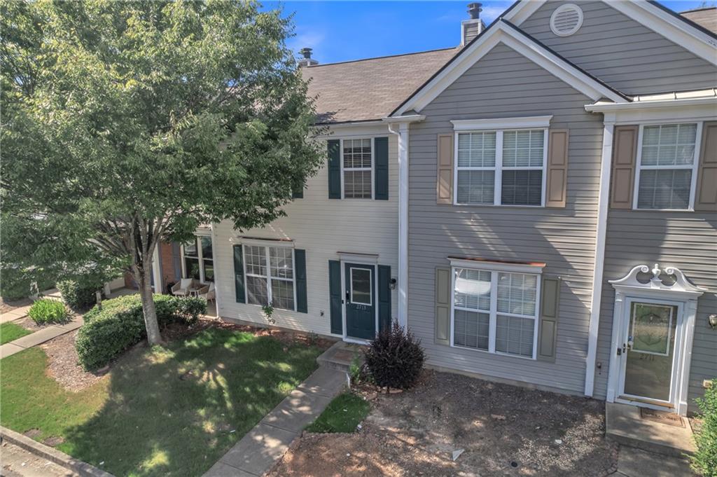 Don’t miss this incredible opportunity to own a beautifully maintained townhome in the highly sought-after community of Windward Pointe! Located at 2713 Ashleigh Lane in the heart of Alpharetta, this charming two-story residence offers the perfect blend of comfort, convenience, and low-maintenance living. Step inside to discover an open-concept floor plan featuring a spacious living room with abundant natural light, perfect for relaxing or entertaining guests. The bright kitchen boasts modern appliances, ample cabinet space, and a breakfast bar that flows seamlessly into the dining area. Upstairs, you’ll find two generously sized bedrooms, including a luxurious owner’s suite complete with vaulted ceilings, a walk-in closet, and a private en-suite bath. A second full bath and laundry room provide added functionality and ease. Enjoy morning coffee or evening breezes on your private back patio, with a quiet wooded backdrop offering extra privacy. This well-kept community features beautifully landscaped grounds and is conveniently located just minutes from Avalon, downtown Alpharetta, top-rated schools, parks, and GA-400. Whether you're a first-time buyer, downsizing, or looking for a great investment, this move-in ready home is a must-see!