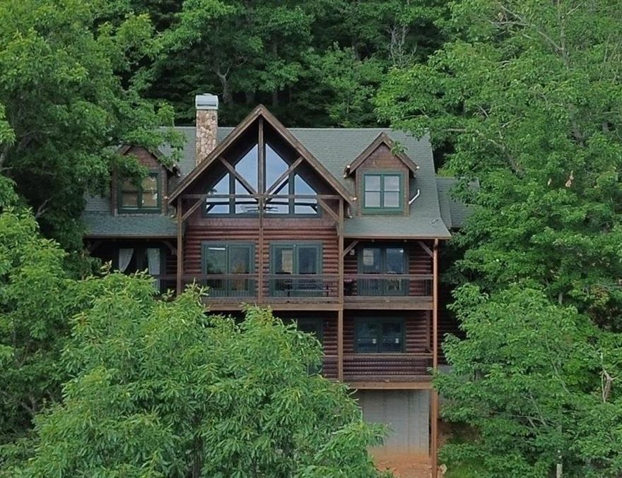 The views this home offers are truly stunning. Enjoy year around long distance views in this luxury cabin retreat. This log home is majestic with its rich wood interior and huge sense of space. You're also a short drive to Lake Blue Ridge, Toccoa River, Outdoor recreation opportunities abound. Proximity to downtown Blue Ridge as well. When the recreating is winding down this stunner of a home welcomes you back from you adventures with serenity and open arms.