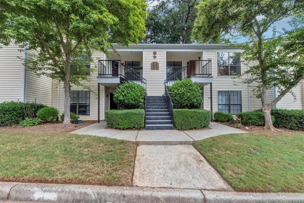 Welcome to this charming 2 bedroom 2 full bath condo, located in a quiet, well-maintained, neighborly, pet-friendly community. Located minutes away from a major highway, several schools, and eateries, as well as great amenities including a clubhouse, tennis courts, swimming pool, and security. The condo features one assigned parking space with additional guest parking. Adjoining the living room, dining room, and breakfast bar is a laundry area off the galley kitchen with ample cabinetry. Wall to wall carpet throughout provides warmth, as does the gas fireplace in the living room for cool nights. A very large master bedroom includes an en-suite bath and walk-in closet. Enjoy peace of mind with recent updates: newer roof, AC, dishwasher, refrigerator and water heater.