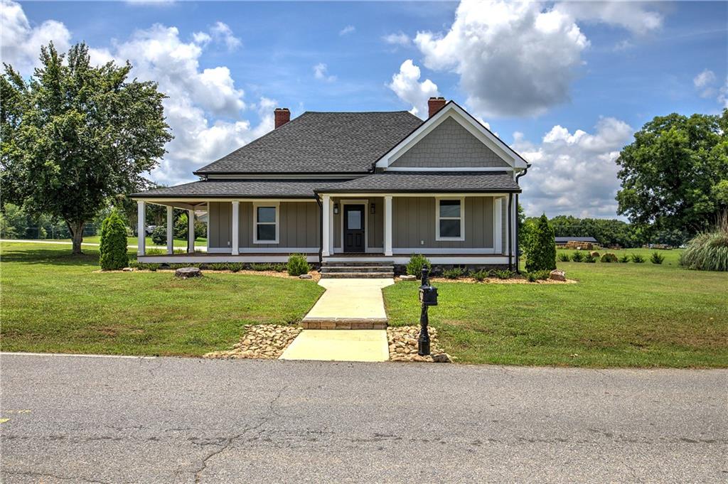 Come fall in love with this truly special home.
Rare opportunity to own a completely renovated home in the heart of Taylorsville. Located on sought-after Main Street, this 3-bedroom, 2-bath home has been rebuilt from the ground up—preserving its original charm while adding top-of-the-line modern finishes. Interior features include an open floor plan, a spacious master suite with a private bath, walk-in closets in all bedrooms, and a full dining room. The gourmet kitchen boasts custom cabinetry, quartz countertops, a walk-in pantry, and white oak hardwood floors throughout. Bathrooms, laundry, and mudroom are finished with tile.
The home includes original 11’ ceilings, mantles, and wainscoting, plus crown molding. Approximately 2,200 sqft heated and cooled, with spray foam insulation for energy efficiency.
Exterior features include brand new concrete board siding, new porch flooring and ceiling, fresh landscaping, new driveway and sidewalks, and a 24x24 open carport with an attached 12x24 enclosed storage space with 9’ garage door.
New HVAC, plumbing, electrical, roof, windows, and sheetrock. Located in a quintessential family-friendly town within a great school district. Convenient to Cartersville and Rockmart (15 mins), Rome and Kennesaw (30–45 mins), and Atlanta (1 hour).
Move-in ready with historic charm and modern upgrades throughout.