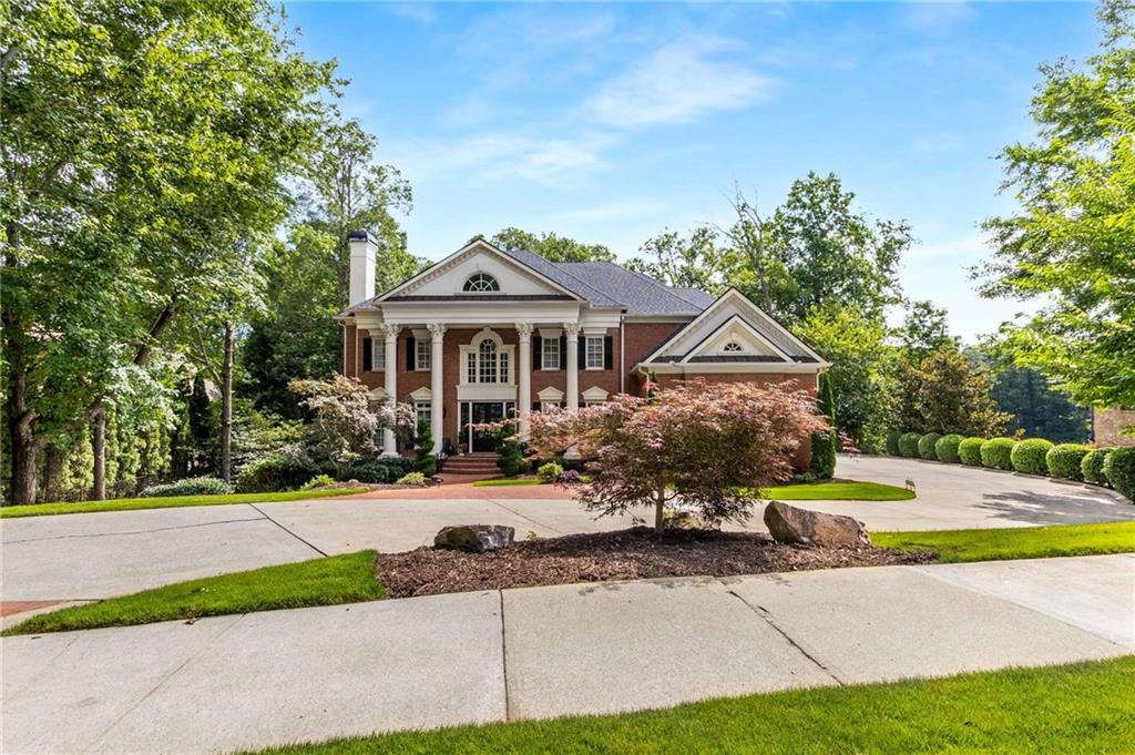 Step into timeless sophistication and grand-scale living in this exquisite European-style estate, nestled within the exclusive gated enclave of Sugarloaf Country Club. Boasting 9,247 square feet of expansive space—including over 6,100 square feet above ground—this five-bedroom, five full and two half-bath residence combines architectural grace with enduring quality.
A stately two-story foyer introduces the home with sweeping European-inspired dual staircases, intricate crown molding, and rich hardwood floors that flow throughout. Designed for both refined entertaining and intimate everyday living, the expansive layout features a main-level guest suite with private bath, multiple living areas, and five fireplaces—including in the formal living room, executive office, and the sumptuous owner's suite.
At the heart of the home, a chef’s kitchen showcases custom cherry cabinetry, stone countertops, stone flooring, and top-of-the-line appliances. A generous eat-in breakfast area opens to a warm keeping room, while the formal dining room easily accommodates a large table—perfect for hosting elegant dinner parties. The handsome office exudes professionalism with cherry wood built-ins and a stately ambiance.
The owner’s suite is a retreat in itself—offering a private sitting area, fireplace, spa-like bath with soaking tub and oversized shower, dual vanities, and a roomy walk-in closet. Each secondary bedroom features its own en-suite bath, ensuring comfort and privacy for all.
The walk-out terrace level—currently unfinished—offers 3,261 square feet of untapped potential with golf course views and direct outdoor access. A three-car garage, spacious laundry/mudroom with sink, 2023 roof, and whole-house water filtration system round out the thoughtful, high-end features of this estate.
Situated on a private, beautifully landscaped lot, this residence offers the perfect blend of serenity and luxury. Sugarloaf Country Club provides optional access to TPC Sugarloaf with world-class golf, a resort-style Lifestyle Center featuring fitness, tennis, swimming, and exclusive clubhouse dining.