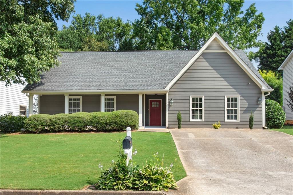 Discover your perfect home in Johns Creek! This charming 4-bedroom, 2 full bathrooms ranch home offers an inviting and comfortable living space for you and your family. With no mandatory HOA , this home provides the flexibility and freedom you're looking for! As you approach the house, you'll be greeted by a large covered front porch, perfect for enjoying your morning coffee or relaxing in the evening. Step inside to find a beautifully updated kitchen, complete with granite countertops, white cabinets, and stainless steel appliances—ideal for the home chef. The great room includes vaulted ceilings and a gas fireplace. The master suite is a true retreat, boasting vaulted ceilings, two walk-in closets, and a beautifully updated master bath. One of the standout features of this home is the recently converted garage, which has been transformed into an additional room with LVP flooring and a closet. This versatile area can be used as a home office, playroom, or bedroom. Step outside to your spacious fenced backyard, where you'll find a deck perfect for entertaining and a newly added storage shed. Located in a top-ranked school district, including Ocee Elementary, Taylor Road Middle, and Chattahoochee High School, this home is perfect for families. Enjoy the convenience of being close to Webb Bridge Park, Avalon, downtown Alpharetta, and all the wonderful amenities Johns Creek and Alpharetta have to offer. Don't miss the opportunity to live in this fantastic property!