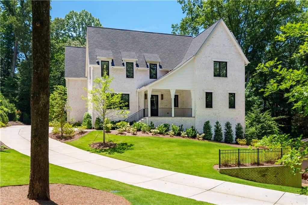 BRAND NEW HOME located on a quiet street only 100 yards from Chastain Park! Ditch the car and commute to all of your sports and activities by foot or on golf cart from this prime location that will literally change your life! The beautiful home was designed by architect Tim Adams and features a spacious floorplan with a primary suite on the main level, 3 car garage with EV charger, finished terrace level, and covered outdoor patio overlooking a swimming pool with spa and grassy yard. It is so close to the park you will enjoy a view of the golf course from the covered patio during the fall and winter. Top quality features include aluminum clad windows, wide-plank wood floors by European Wood Co, high ceilings and beautiful fixtures and lighting.
The light-filled kitchen features custom white cabinets and a large center island topped with marble counters, Wolf range with hood, SubZ fridge/freezer and beverage center. A 2nd laundry room and separate mud room are conveniently located just inside from the 3-car garage.
The kitchen opens to the everyday dining area and a spacious family room which features a fireplace and french doors leading to a lovely covered patio with a cozy fireplace, stone floors and beamed ceiling overlooking the a serene forest view beyond. This is the ideal space to dine, entertain and relax alfresco day or night all year 'round!
The formal dining room is accessed from the kitchen through the butler's pantry, fully outfitted with cabinets, sink, ice maker and beverage refrigerator. A massive walk-in pantry provides plenty of kitchen storage and could be built out as a working kitchen/scullery if needed.
The primary suite is well thought out and an ideal size. A high vaulted ceiling, and a seating alcove are accentuated by the soft natural light and private wooded views. The primary bath features a delicate blue paint, softly veined marble floors, counters and tiles, separate his & hers vanities, a large shower with dual shower heads, and large closets ready to be customized based on individual wardrobe needs.
Upstairs at the top of the stairs is an open area for a den or study, four large bedrooms each with ensuite baths and walk in closets, a separate flex room for a playroom or TV room and a full laundry room.
The terrace level opens to a covered patio and backyard. There are a bedroom and bath, two huge daylight recreation areas, a wine cellar, and a powder room.
This brand new home has all the bells and whistles, a well thought-out floorplan, is close to Buckhead shopping and schools and right in the heart of all that Chastain Park has to offer!