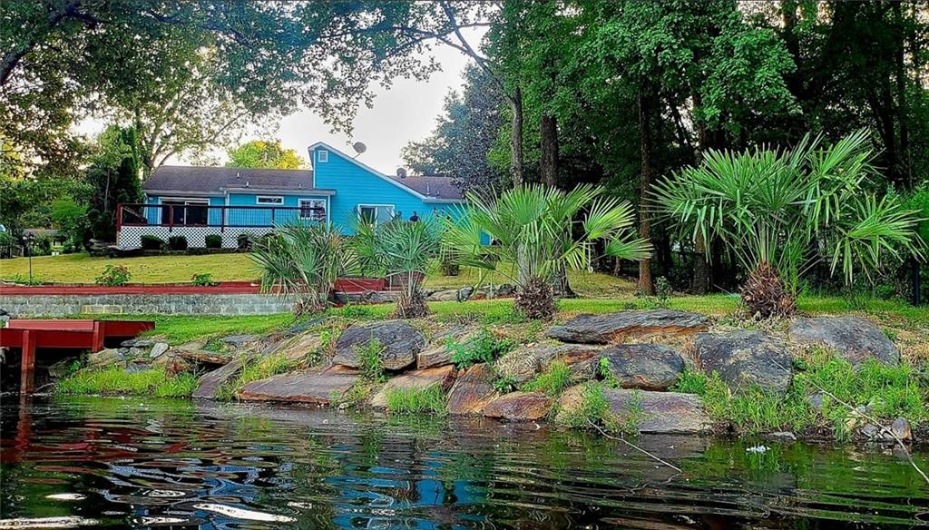 Location, Location, Location! Don't miss this rare opportunity to own a fully updated, stepless one-story ranch on a private lakefront lot just a mile from the heart of Duluth! Ideally located between Pleasant Hill and Buford Highway, you'll enjoy quick access to Costco, Sam's Club, Walmart, HMart, Kroger, and more. This home sits on a third of an acre of private lakefront backyard and has been completely renovated from top to bottom, including completely updated bathrooms, new flooring, new walls, new cement hardy plank siding, modern finishes throughout, and fresh paint inside and out. Home's HVAC is 5 years old, and the water heater is 2 years old. Step outside and enjoy the best of lakefront living with two new spacious decks-one attached to the home and the other right on beautiful Berkeley Manor Lake Inverness/Morrison Lake, with your very own private dock for fishing, boating, or simply relaxing by the water. In this home, you will enjoy the feeling of a getaway and live each day as if you're on vacation without ever leaving your own home. This rare gem won't last long-schedule your showing today! The listing agent is related to the Seller.