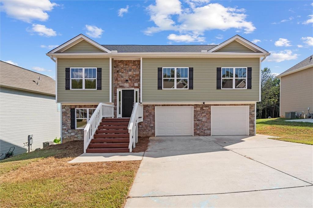 Built in 2020, this beautiful 4-bedroom, 3-bath home feels like new and offers modern style with a functional layout. As you enter, the inviting split-foyer entry leads you into a spacious living room with soaring vaulted ceilings. The upgraded kitchen is a showstopper, complete with stainless steel appliances, stone countertops, a trendy backsplash, and a large pantry for storage. The oversized owner's suite is a true retreat with trey ceilings, a massive closet, and an upgraded bathroom. Two additional bedrooms and a full bath round out the main floor. The lower level provides even more living space with a full bedroom, full bathroom, laundry, storage, and a 2-car garage. Located in the vibrant Arbor Chase subdivision, residents enjoy access to exceptional amenities including a swimming pool, pickleball court, basketball goal, clubhouse, recreational areas, and so much more perfect for both relaxation and play.