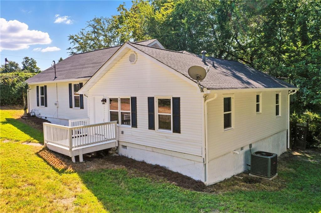 This charming and fully updated ranch home offers 3 spacious bedrooms, 2 full bathrooms, and stylish LVP flooring throughout for a seamless, modern look. The sparkling kitchen is a standout, featuring crisp white shaker-style cabinets, granite countertops, a classic subway tile backsplash, and updated appliances—perfect for both everyday living and entertaining. Both bathrooms have been thoughtfully renovated with matching white cabinetry and granite counters, providing a fresh and cohesive feel throughout the home. Step outside to a cozy covered patio—ideal for relaxing with a glass of lemonade or enjoying the outdoors. Conveniently located near shopping, dining, and medical facilities, this home combines comfort, style, and unbeatable convenience. Don't miss the opportunity to make it yours!