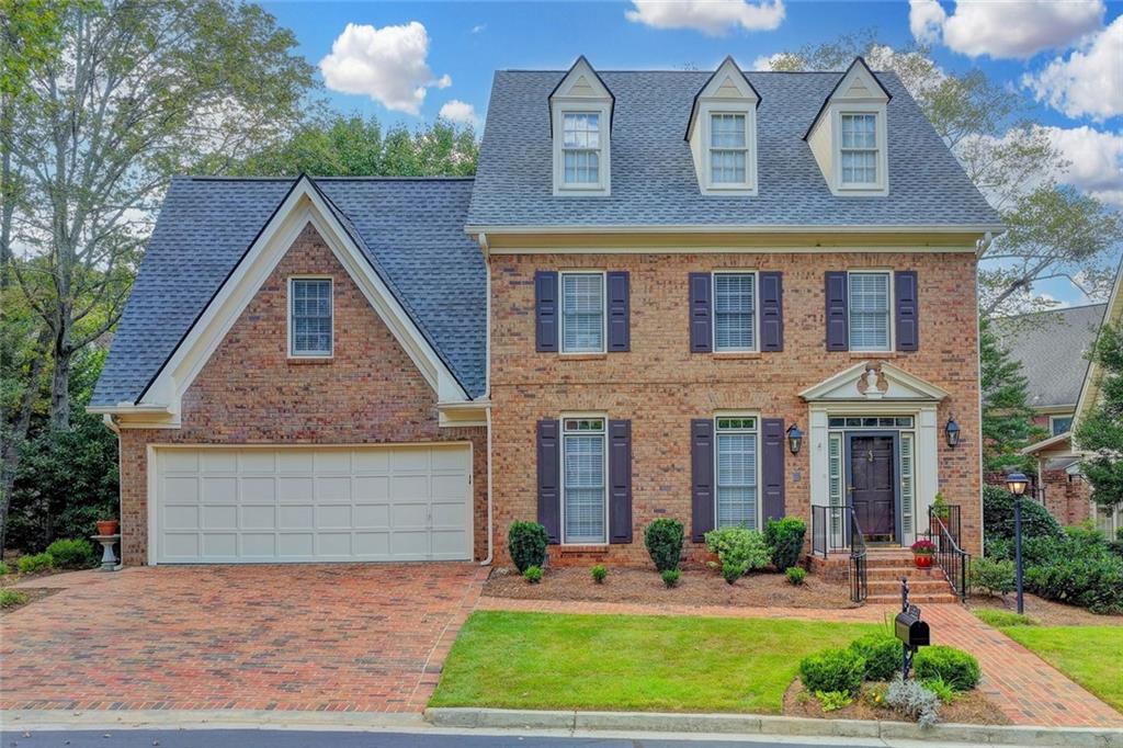 Are you searching for the perfect home in the perfect Dunwoody location, at a perfect price and move in ready? Time to unpack! This charming 2 story brick across from Dunwoody Country Club and walking distance to shopping, grocery stores and restaurants is the lifestyle you have been searching for. Brand new roof, 9 ft ceilings on the main, and fireside keeping room. Renovated white kitchen with a large deck overlooking your yard, perfect for that morning coffee. A large dining room is ready for family gatherings and entertaining. Upstairs an oversized master awaits with a large walk-in closet and gorgeous renovated master bath. An additional 2 bedrooms up and hardwoods throughout the main. This sought after community of the Woodlands has all the amenities, a strong HOA, community Pool and Clubhouse and yard Maintenance for that stress free lifestyle. In addition to great walkability, you are minutes to GA-400, I-285, Sandy Springs and Buckhead, Roswell, and Alpharetta. This home is a true gem!