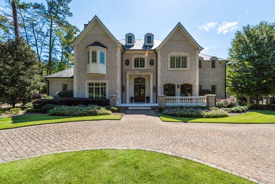 Grand home on sought-after Rebel Trail is perfectly situated on 1.14+/- acres. Gorgeous features include master on each level, oversized kitchen, limestone foyer, living room with French doors leading out to the patio and pool. Upper level hosts 4 bedrooms all with en-suite baths. Finished terrace level has full kitchen, media room, recreation room, bedroom, bath & safe room. Meticulously maintained manicured grounds includes pool with water feature, spa, covered patio and level backyard. Gorgeous circle driveway and completely gated.