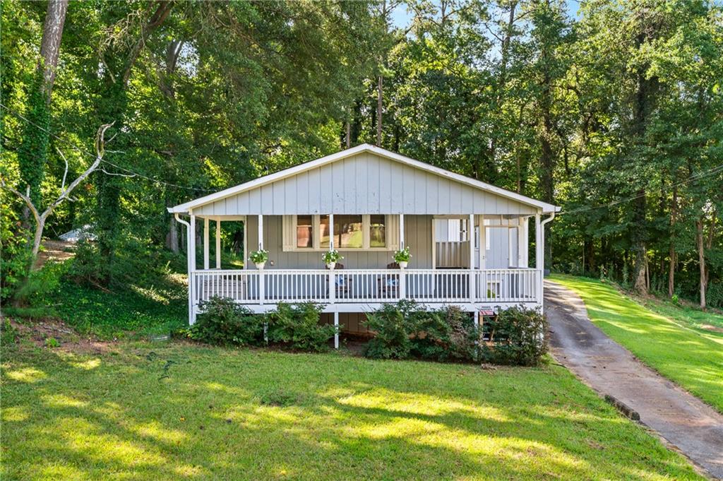 Welcome to this beautifully updated home situated on a spacious lot with a wooded backyard—offering complete privacy and no future building behind you. Enjoy peaceful mornings on your private front porch, perfect for a cup of coffee or quiet relaxation.
Inside, the open-concept layout is bright and inviting and the layout is ideal for entertaining, with plenty of space for both a large dining area and oversized living room furniture. The updated kitchen is a true showstopper, featuring stainless steel appliances, ample counter space, and modern finishes. Both bathrooms have been tastefully updated, and the oversized primary suite boasts separate his-and-her closets.
Two spacious guest bedrooms provide comfort for family or visitors, while the laundry room is conveniently located in the mudroom as you enter from the back. A single-car garage with an additional carport offers plenty of parking and storage.
Downstairs, you’ll find a versatile space perfect for a workout room, home office, or bonus room—tailored to fit your lifestyle.
With no HOA, this home gives you the freedom you want in a beautiful, private setting.