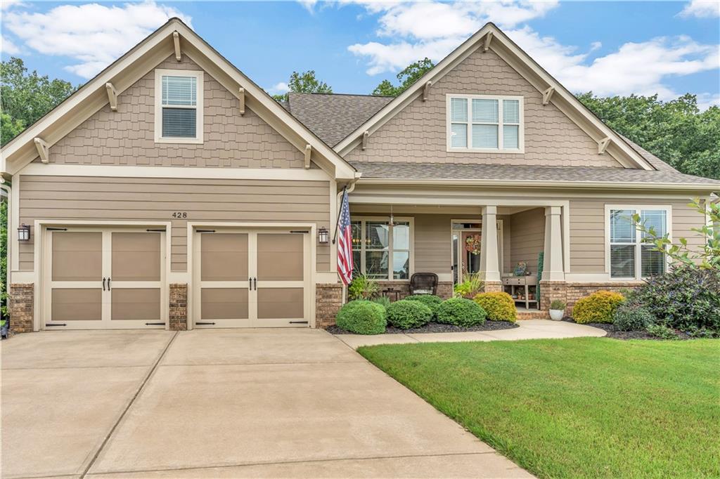 In the picturesque Preserve at Canyon Ridge, this inviting two-story, 4-bedroom, 3-bath home with a partially finished basement welcomes you with a spacious front porch and a floor plan that blends open gathering spaces with private retreats. The main-level owner’s suite features a walk-in closet, glass shower, and dual vanities, while a nearby bedroom and bath offer flexibility for an office, nursery, playroom or guest suite. Upstairs, two bedrooms share a full bath and an airy loft overlooking the great room, where soaring ceilings, a gas fireplace, and large windows frame serene woodland views. A roofed, screened rear porch with durable Trex flooring captures cool breezes year-round, offering a peaceful vantage point over the HOA-owned hardwood forest. Thoughtful upgrades include a whole-house natural gas generator, central vacuum system, 52" ceiling fans, deep crown molding, soft-close cabinets, low-e windows, wrought iron staircase spindles, built-in stereo, and an oversized epoxy-floored garage. The full partially finished basement, with foam-insulated exterior walls, daylight windows, built-in cabinets, a half bath, and a “storm shelter” room, is ready for finishing. Additional highlights include a 75-gallon gas water heater, radon mitigation system, and fresh exterior paint in 2023, creating a home that offers comfort, style, and readiness for every season. This gorgeous property won't be available for long... schedule your showing today!!