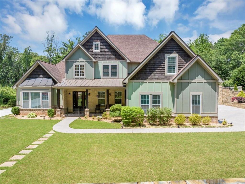 Welcome to 3036 Hunt Road, Acworth, GA 30102 — a stunning custom-built craftsman estate situated on a private 2-acre lot in the foothills of North Georgia, listed at $1,350,000.
This luxurious 4,363 sq ft home, built in 2018, features 5 bedrooms and 3.5 baths, including oversized dual master suites, perfect for families or multigenerational living.
The gourmet kitchen is designed for both function and style, offering a center island, tile countertops, breakfast bar, eat-in area, walk-in pantry, and built-in wine rack. Ideal for entertaining, the home boasts a formal dining room that seats 12+, media and game rooms, a full home theater, wine cellar, and flexible spaces for a workshop or home gym.
Interior highlights include high, coffered, tray, cathedral ceilings, crown molding, hardwood floors, a cozy fireplace, his-and-hers closets, and high-speed internet. Outdoors, enjoy a tranquil retreat with a covered front porch, breezeway, large back deck, and an in-ground pool with a cabana—all surrounded by wooded privacy fencing.
The property also includes a three-car garage and additional RV/boat parking via a long concrete driveway. Located in Acworth, “The Lake City,” with close proximity to Lake Allatoona, Lake Acworth, and the charming downtown area, the home is zoned for highly rated Cherokee County schools including Clark Creek Elementary, E.T. Booth Middle, and Etowah High School.
This estate combines timeless craftsmanship, generous living space, resort-style amenities, and a premium location into one truly exceptional opportunity. Schedule your private showing today with listing agent Jonathan Mikula, Sanders RE, LLC.