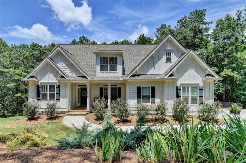 Come enjoy the peace and quiet of living in this gorgeous "Like New" 4 Bedroom, 2.5 Bath Custom home on 2 acres within 1 mile of Lake Allatoona Beach access and BOAT RAMP!! NO HOA!! This home has been loved and cared for by the current owners since it was completed in July 2018!! It features the Owner's suite on the main with warm hardwood floors in the bedroom, designer colors and a master closet that is huge! The large Family room features hardwood floors, a Vaulted ceiling and a stacked stone fireplace w/ gas starter! It is open to the deluxe kitchen with white cabinetry, granite countertops, tiled backsplash, high-end Black stainless gas stove, double ovens and appliances and a Huge Island!! The screened porch is just off of the kitchen breakfast area. This porch is perfect for watching nature or the kids playing in the fenced back yard! The main level also features a large laundry room with sink and storage just as you come in from the garage! The inviting Dining room has a coffered ceiling and room for large gatherings with family and friends and tons of natural light coming in through the windows! Upstairs features 3 large bedrooms with a full bath and large closets. This home features Oversized door casings & Crown Molding! All of this is on a FULL BASEMENT which can be finished to add an entire extra living space and is stubbed for a full bathroom! This home has a large 2. acre lot and plenty of privacy w/ room for a Garden! Blueberry bushes are already planted! Come see this fabulous HOME!