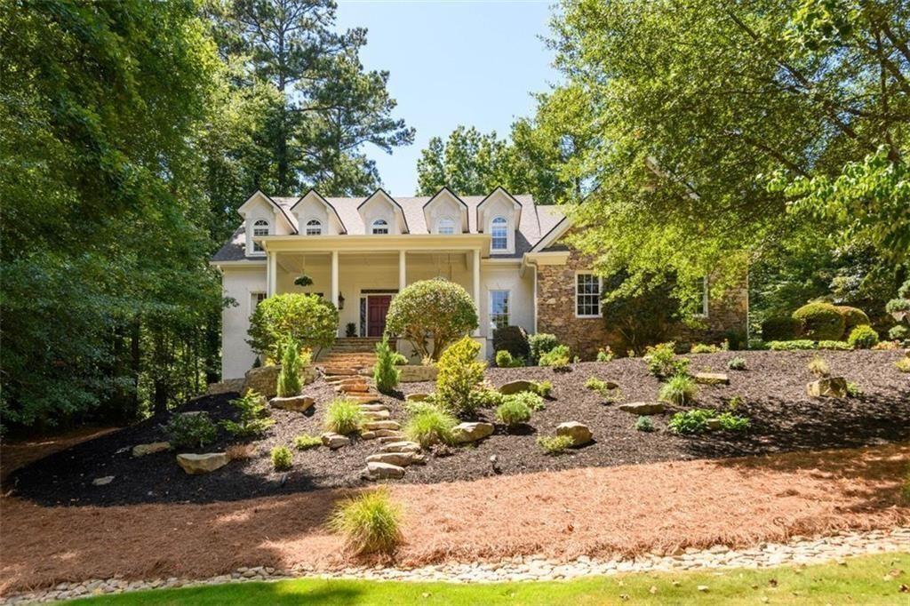 Park-Like Retreat in the Heart of Johns Creek!
Step into timeless elegance with this exceptional 5,000+ sq ft estate nestled on over an acre of beautifully landscaped grounds in one of Johns Creek’s most sought-after neighborhoods—known for its safety, top schools, and vibrant lifestyle. Set on a raised elevation, the home boasts breathtaking curb appeal, with custom fully irrigated landscaping, landscape lighting, and a wide front porch that welcomes you into a world of warmth, luxury, and function.
Inside, soaring ceilings over 20 feet high in the great room frame a mahogany wall of windows that draw your eye to the stone and timber veranda overlooking the spectacular outdoor setting. The open floor plan with hardwood floors offers effortless flow, yet maintains a cozy, inviting atmosphere perfect for both grand entertaining and intimate evenings.
At the heart of the home is a chef’s dream kitchen—commercial-grade appliances, copper farmhouse sinks, custom cabinetry, and expansive prep space for everything from small dinners to large-scale entertaining. A large walk-in pantry with laundry hookups provides one-level living flexibility, complementing the spacious main-level primary suite, complete with a sitting area, custom closet cabinetry, and luxurious bath.
Upstairs, you’ll find three generously sized bedrooms, two full baths, a charming playroom or art studio, and a full laundry room. The finished terrace level offers incredible versatility with a private in-law suite, full kitchen area, gym, workshop, theater, and game room—perfect for multigenerational living or serious entertaining.
Step outside to your private sanctuary: a sprawling veranda with stone flooring, pine tongue-and-groove ceilings, hand-carved mortise and tenon framing, and wood trusses. The outdoor kitchen features a Big Green Egg, gas grill, fridge, ice maker, expansive serving/dining counter and custom lighting—ideal for unforgettable gatherings. Stroll winding paths through the backyard, relax by the self-draining, large stone fire pit surrounded by natural boulder seating, or enjoy the magic of custom lighting under the canopy of stars and trees.
Every detail has been meticulously maintained—fresh interior and exterior paint, updated systems, whole-house on-demand water heating, and a new roof in 2023. This incredible home is truly move-in ready.
Located in Johns Creek—named the #1 Best Place to Live in the U.S. by U.S. News & World Report in 2025—this home is just minutes from top-ranked public and private schools, the Atlanta Athletic Club, premier golf, dining, parks, river access, and theaters. This is not just a home—it’s a lifestyle.
*Source: U.S. News & World Report, “Best Places to Live in the U.S.,” 2025–2026*