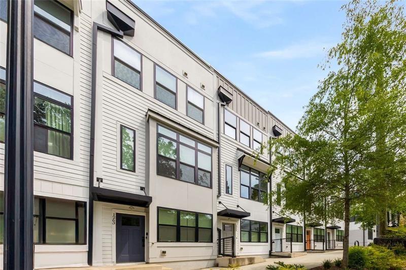 Modern Living in the Heart of East Atlanta Village! Just steps from the vibrant core of East Atlanta Village, this stylish contemporary townhome places you in one of Atlanta’s most energetic and walkable neighborhoods—surrounded by beloved local restaurants, shops, and the weekly farmers market.
Inside, sleek modern design meets effortless functionality. Soaring ceilings and oversized windows fill every space with natural light, while thoughtful finishes add a refined touch throughout.
The entry level features a flexible bonus room—perfect as a home office, playroom, or potential 3rd bedroom—plus a convenient closet and foyer. Upstairs, the open-concept main floor is bright and inviting, ideal for both entertaining and everyday living. The showstopping kitchen boasts Quartz countertops, custom cabinetry, stainless steel appliances, a statement tile backsplash, built-in coffee bar, expansive island, and a full wall of windows that feels like art.
A chic powder room completes the main floor. Upstairs, retreat to the sunlit primary suite with a spa-like ensuite bath featuring dual vanities and a frameless glass-tiled shower. A spacious secondary bedroom and full bath provide the perfect setup for guests, family, or a roommate.
The crown jewel? Your private rooftop terrace—an outdoor oasis for grilling, lounging, or soaking in the skyline views year-round. A rare tandem two-car garage offers generous parking and storage—an exceptional find in this coveted area.
Enjoy walkable access to Bellwood Coffee, Argosy, Banshee, Brownwood Park & Tennis Courts, and more. Plus, you're just minutes from the Southside BeltLine, connecting you to Inman Park, Grant Park, Midtown, and beyond.
Don’t miss this opportunity to own a turn-key, design-forward home in one of Atlanta’s hottest neighborhoods. Welcome to vibrant living in EAV!
