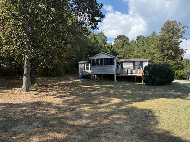 Don't miss this opportunity---Ideal for investors or homeowners. Enjoy newer LVP flooring in family room & bedrooms. Newer water lines. Central HVAC approximately one year old. Low maintenance vinyl siding. Screened in front porch overlooking spacious front yard. Outbuilding for storage Whether you're looking a steady rental, or an affordable place to call home, this property checks all the boxes. Property sold as is.