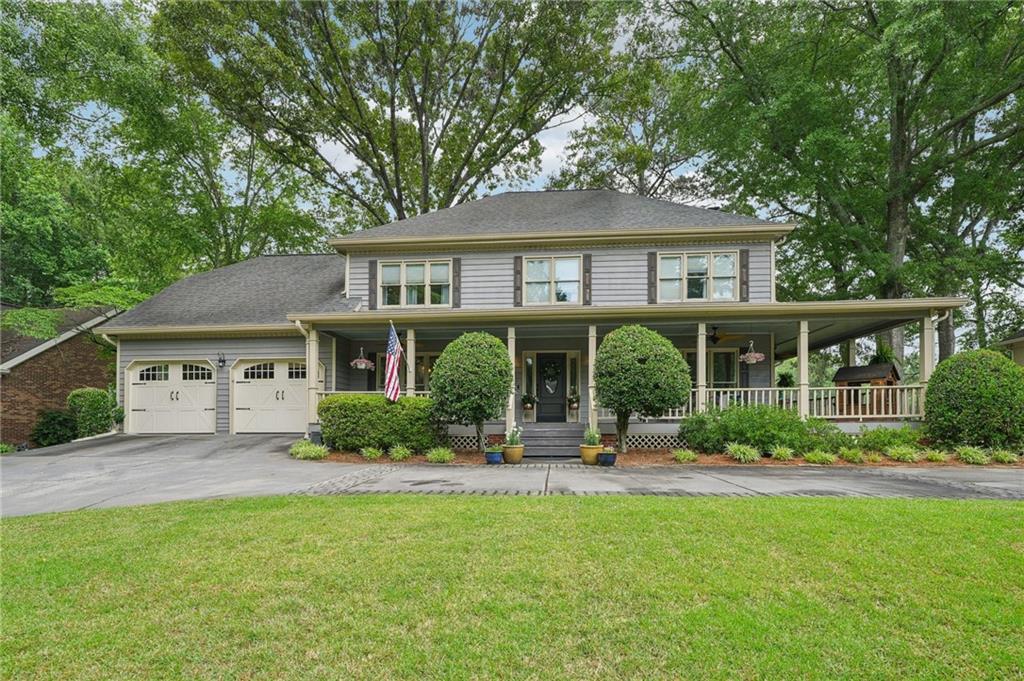 A Charming Lakefront Retreat in the Heart of Coopers Pond!
This beautifully maintained Southern-style home invites you in with a stunning wrap-around porch—perfect for morning coffee or unwinding as you take in the peaceful sights and sounds of the neighborhood. Step inside to a bright and welcoming entry foyer, flanked by an elegant formal dining room and a light-filled formal living room with direct access to the porch.
The heart of the home is the fireside family room, offering breathtaking views of Coopers Pond—ideal for cozy evenings or entertaining guests. The spacious kitchen is a chef’s dream, featuring granite countertops, a center island with a butcher block top and breakfast bar, updated stainless steel appliances, and a casual dining area.
Upstairs, you'll find a luxurious primary suite complete with trey ceilings, a separate sitting area, and an ensuite bathroom with French doors, dual vanities, a soaking tub, and a separate walk-in shower. Additional highlights include a newly remodeled laundry/mudroom with ample storage, insulated garage doors for added comfort, and a semi-circular driveway with level parking—perfect for hosting gatherings.
Enjoy direct access to Coopers Pond right from your backyard, where boating and fishing are just steps away. The spacious back deck provides the perfect setting to relax and take in the stunning waterfront views.
Don't miss this rare opportunity to own a lakefront gem in one of Lawrenceville’s most sought-after communities!