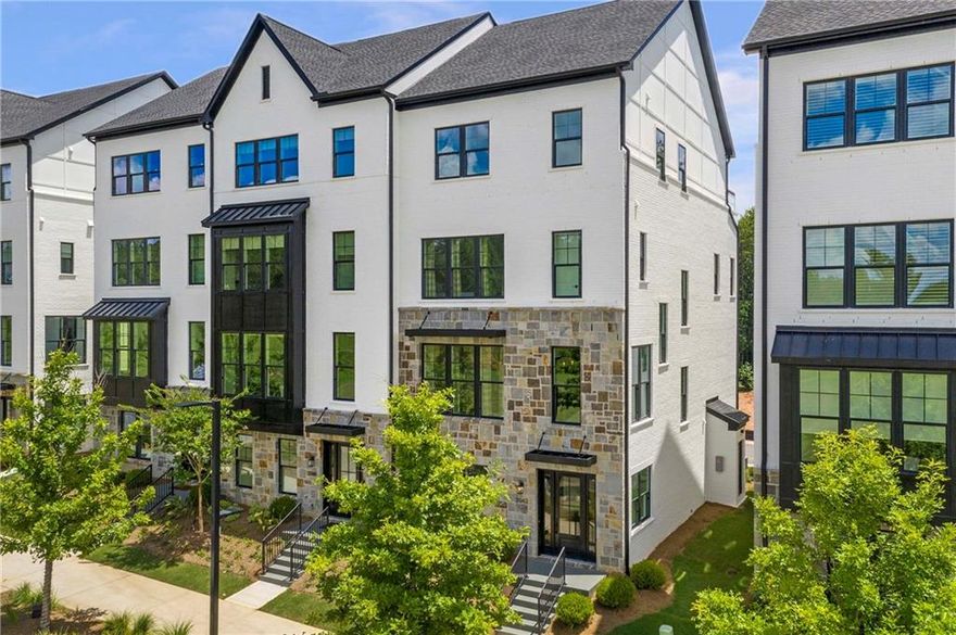 This FULLY-FURNISHED, luxury 4-story townhome offers 3,700 sq. ft. of living space, features an elevator along with 4 bedrooms and 4.5 baths, nestled in the highly sought-after Toll Brother's  Lakeview Community in Alpharetta. Located less than 2 miles from Avalon and the Alpharetta Town Center, this home is set in a picturesque, park-like environment overlooking a serene natural lake. The area boasts hiking, biking, and running trails, with an eventual connection to the Alpha Loop. This move-in-ready townhome is perfect for the most discerning tenant.  With 10 ft. ceilings and a grand 2-story foyer, this home includes a private elevator and a spacious second-story rear deck. The fourth-story rooftop terrace is ideal for entertaining, adjacent to a large, open loft. The resort-style master suite includes tray ceilings and a spa-inspired master bath. Walk-in closets can be found throughout, while the chef's kitchen features an oversized center island, butler's pantry, and walk-in pantry. A cozy living room with a fireplace and a 2-car garage with an EV charging station complete the home. Located at 2042 Juliette Ave., Alpharetta, and built in 2025, this townhome offers one of the most desirable, move-in-ready options in the northern suburbs of Atlanta.  The home is also furnished with impeccable taste, featuring high-end, aesthetic furnishings, wall-mounted 77" and 83" TVs in the living room and loft, and Wi-Fi extenders. These elements create a curated, upscale atmosphere for anyone seeking the epitome of luxury living.  Toll Brothers @ Lakeview community features include: rooftop terraces offering expansive space for seamless indoor-outdoor living in select plans, A resort-style pool, outdoor kitchen, fitness center, and pet spa as part of luxury amenities at neighboring Eden, close proximity to Avalon and Downtown Alpharetta for premier shopping, dining, and entertainment, convenient access to the Alpha Loop, with 1.1 miles of the loop planned to run through the Lakeview community. Welcome home!