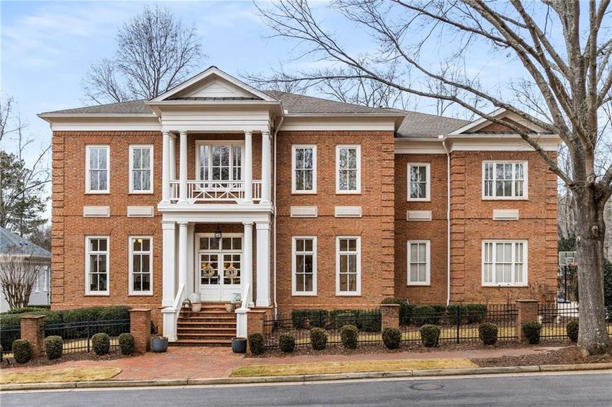 Charleston meets Atlanta In this stunningly-renovated Antebellum replica. Located in the picturesque, gated community of Ellard in East Roswell, this all-brick masterpiece hearkens to days gone by where quality construction and craftsmanship were the standard, not an option. Enjoy all-brick construction, soaring 12-foot ceilings, abundant natural light, beautifully refinished hardwood floors, crisp white paint and incredible millwork throughout. The thoughtfully renovated interior will allow you to move right in and instantly begin enjoying your new home without the woes of a major project. The covered front porch of the home greets you as you overlook one of the neighborhood's multiple park areas upon arrival. A two-story foyer and curved staircase are the perfect welcoming details. Flanked by a large formal dining room and formal living room (or ideal office space), you'll feel as though you've stepped back into the entertaining spaces of a bygone era but with updated, modern touches. A gorgeous chef’s kitchen is the heart of this home with an open-concept layout that’s perfect for daily life and soirees alike. Luxury appliances, honed quartz countertops, a marble backsplash, a massive amount of white cabinetry and even a dog watering station make this a space in which you'll love spending time. The butler's pantry and large walk-in pantry are added conveniences. The main level is completed by a stunningly renovated powder room, molding-clad bedroom and full ensuite bath, a huge new rear porch with composite decking and an oversized 3-car garage. Retreat to the "sleeping quarters" of the home upstairs where you'll find the primary suite with a sitting room, wet bar, dual walk-in closets and a stunningly redesigned marble-clad ensuite bathroom that evokes the feel of the most luxurious spa. All bedrooms feature triple tray ceilings, ensuite baths and walk-in closets with custom closet systems for ultimate comfort and convenience. The remodeled laundry room is also conveniently located on this level. Take one of the two staircases back down to the main level and on to the finished basement where you'll find new LVP flooring throughout, a massive open-concept living/game room, custom wine cellar, media room, home gym, bedroom, full bath and ample storage. Your flat, sprawling backyard oasis has plenty of room for play and includes a fire pit and gorgeous flagstone patio. Contrary to many of the homes in the neighborhood, this one overlooks a private wooded area with walking trail - the perfect spot to enjoy nature at its finest. Ellard is a community of replica homes designed after Antebellum estates in Charleston, Savannah and New Orleans. There's nothing else like it in Atlanta! In addition, the neighborhood features unmatched amenities such as 24/7 guard-gated access, tree-lined streets with brick sidewalks on both sides, a stunning conservatory, 4 tennis courts, a swimming pool, basketball court, playground, community gym, Chattahoochee River park, walking trails, acres of greenspace and lots of social events throughout the year. Ellard is conveniently walkable to tons of restaurants, retail and parks and just a short drive to top-rated area public and private schools in addition to major highways.