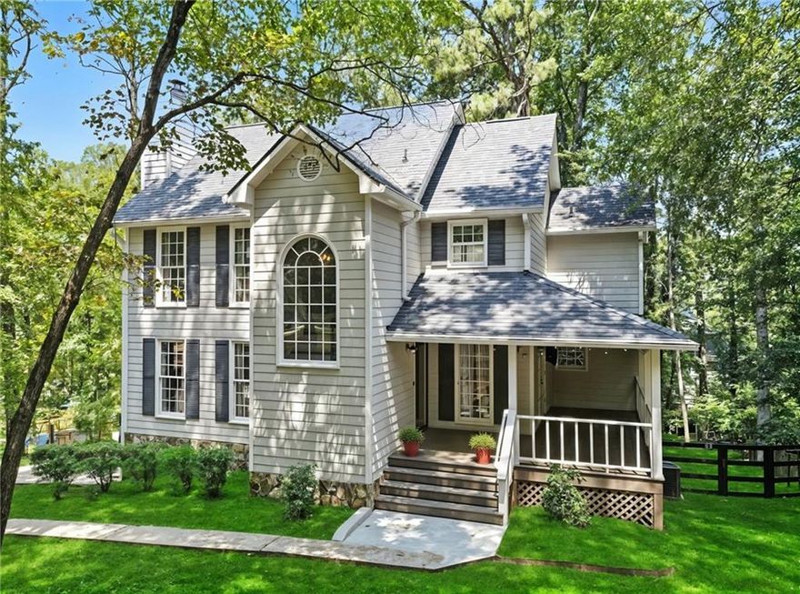 Location, Location, Location....This Beautifully updated 3 bedroom 2 1/2 bath home it situated on a tranquil private wooded .64-acre lot in the beautiful sought-after Swim/ Tennis / Lake community of Crabapple Falls. This meticulously maintained home is move in ready!!! The cozy front porch offers beautiful curb appeal in addition to spacious outdoor living space. The main floor offers spacious Kitchen, Family & Dining Rooms perfect for entertaining. The luxurious 2nd floor owner’s suite features vaulted ceilings and walk-in closet. The 2 car drive under garage has a ton of extra space for a game room, workshop, ATV storage, motorcycles, jet skis, etc. Take time to relax out on the oversized deck that is perfect for grilling out, enjoying your morning coffee, or gathering with family and friends. This gem of a home's location offers easy access to Downtown Woodstock, Milton, Alpharetta, Roswell and Canton. Enjoy the benefit of low Cherokee County taxes as well as excellent award-winning schools.