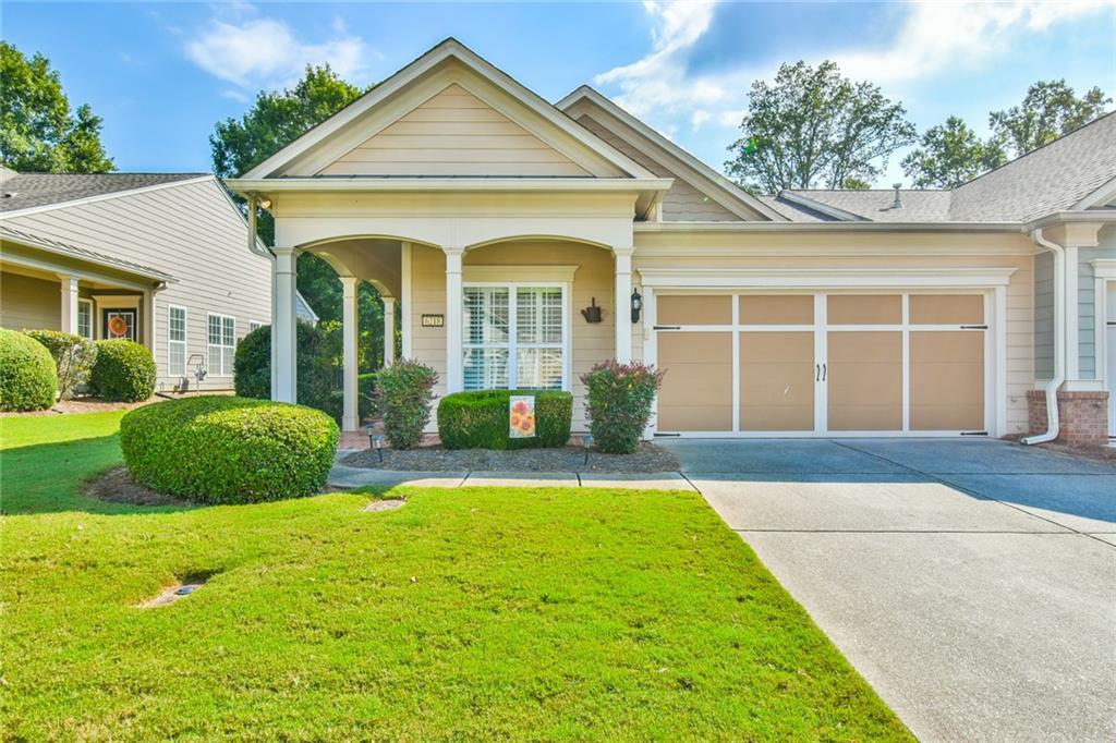 Come see this adorable Muerfield Villa with 2 bedroom, 2 baths, office and picture perfect sunroom. This home has shutters and a doors, in place, on the office. You will also notice the great rocking chair porch, where you can sit and chat with neighbors, or enjoy your coffee. The back yard is good sized for any gardening or fence for your puppy. The HVAC is new and the new washer and dryer are included. Deaton Creek has this special street with duplexes that we call Villas. The Villas take care of the exterior of your home. You will not have to worry about paint, roofs, gutters or landscaping. It is a great way to live your best life and not worry about exterior home maintenance issues. Come see this pretty home today.
