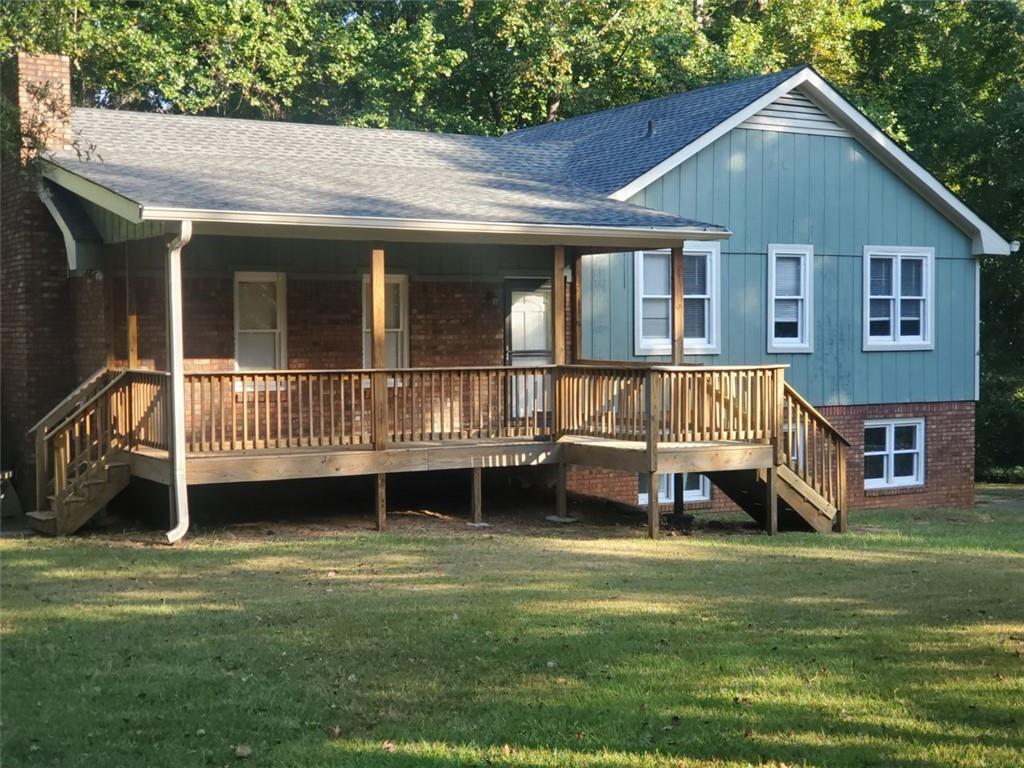 This is it, multi-level home located on a private 2.68 +/- acres. Features include: Covered rocking chair front porch, back deck, private fenced back yard, fresh interior & exterior paint, new Edwards Oak LVP flooring, great room with stone fireplace, kitchen with an abudance of cabinets, black appliance package including range, dishwasher & microwave, ceramic tile bathrooms, finished lower level with 4th bedroom & additional living room. Perfect for a home office set up. Energy effecient spray foam insulation in attic & crawl space. Clean & move in ready. Great Carrollton location. The house is near multiple shopping areas & the University of West Ga.
