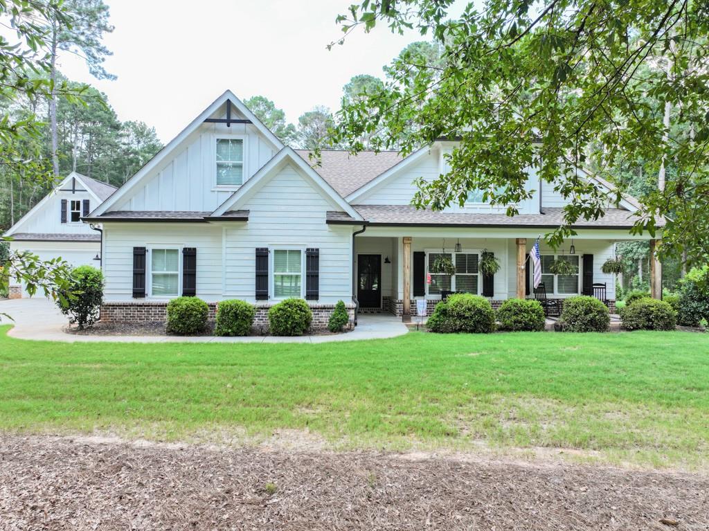 Discover the perfect blend of comfort, charm, and functionality in this stunning home set on 3 private acres. Inside, you'll love the open-concept floor plan featuring high ceilings, a split-bedroom layout, and a spacious kitchen with granite countertops, ideal for entertaining or enjoying quiet evenings at home. A bonus room with a large hallway closet offers flexible space for an office, playroom, or guest suite. Step outside and enjoy your own backyard oasis! The pool with cabana is perfect for summer days, complemented by an adorable pool storage building for all your essentials. Garden enthusiasts will appreciate the cedar gardening shed with chicken coop, raised gardening beds, and a fenced-in garden area ready for planting. Additional highlights include a detached garage and plenty of space to spread out, relax, and enjoy the privacy this property provides. This home is more than a place to live - it's a lifestyle. Don't miss your chance to own this private retreat!