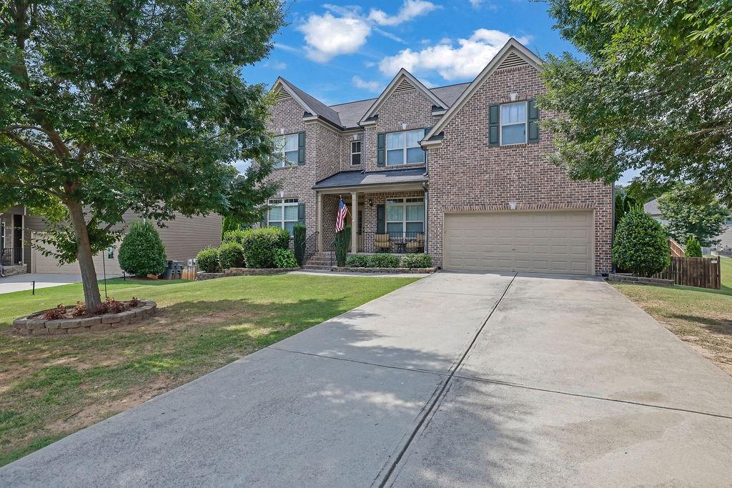 Huge 7-bedroom home in the quiet swim/tennis community of Hopewell Manor.
Outstanding Forsyth schools. The open floor plan is perfect for a large family and entertaining. The great room, oversized kitchen and keeping room all flow seamlessly together. Main floor also contains separate dining room, office, bedroom, and a full bath. Second level features the owner’s suite plus three additional bedrooms and a bath. Terrace level has large open space, 2 more bedrooms and a full bath. Enjoy the fenced backyard from your deck or the patio on the terrace level. Close to 400, and an abundance of shopping, restaurants, and recreation the a growing city like Cumming has to offer.
