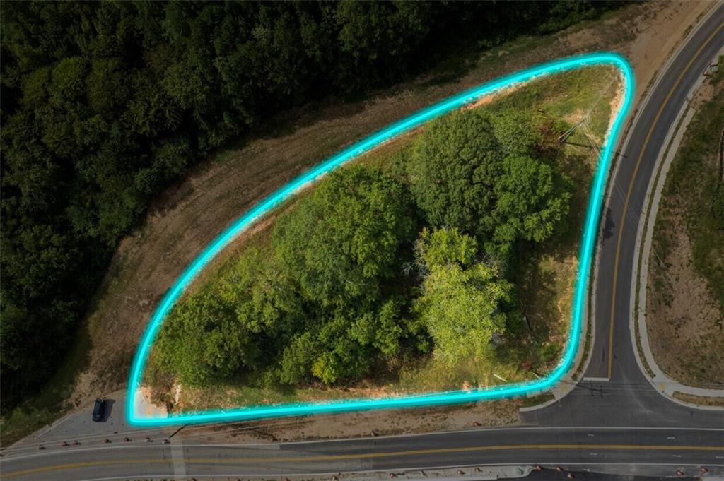 Strategically located, corner plot, offers an excellent opportunity for a high-traffic retail business. Positioned at the intersection of major highways/roads, this property is easily accessible to both local residents and travelers, ensuring a steady flow of customers.
