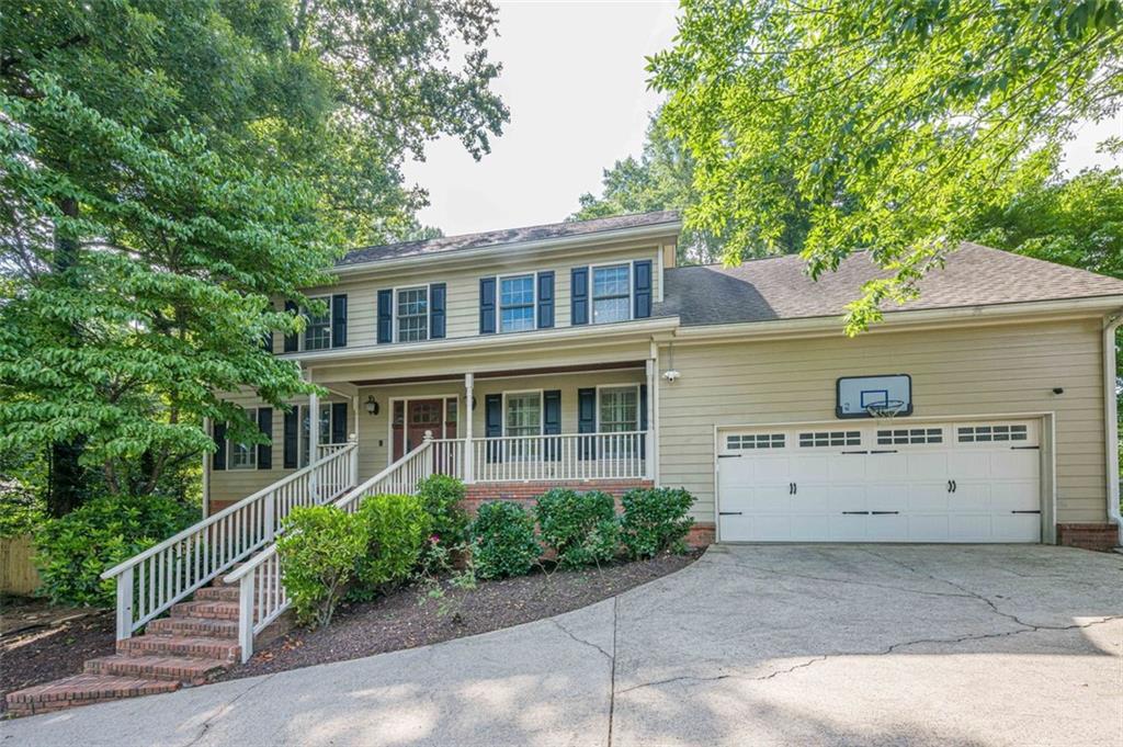 Ideally located just seconds from top-rated North Gwinnett High School, this 3 bedroom, 2.5 bath home offers both charm and functionality with a layout designed for everyday comfort and easy entertaining. Step onto the inviting front porch, featuring wood-planked ceilings, before heading inside, where the main level boasts a formal dining room, cozy living room with a fireplace and stunning built-ins, and a kitchen equipped with stainless steel appliances and a convenient custom drop zone by the garage—perfect for staying organized! The laundry room, just off the kitchen, also has a door leading straight out to the back deck, a thoughtful touch when you need to toss in a load after an afternoon of grilling or outdoor play. The sunroom- flooded with natural light and perfect for that morning cup of coffee- features the same rich wood-planked ceiling as the front porch, and opens to the fenced backyard. With a large custom deck, fire pit area, and garden beds ready for planting, this outdoor space is ready for entertaining or relaxation! Upstairs, the spacious primary includes not one but two closets—one large enough to function as a home office, workout space, or personal dressing room, and complete with a custom closet system. Two additional bedrooms and a full bath complete the upper level.
The partially finished basement offers extra flexible space—ideal for a home gym, playroom, media room, or additional bedroom!
Located in a sought-after school district and close to shopping, dining, and parks, this home combines location, comfort, and versatility- you don't want to miss this one!