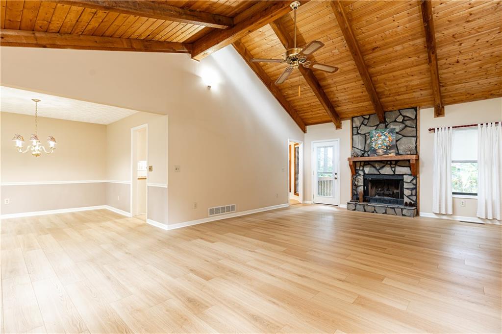Tenant is in the home on a short term lease. Lease must be honored by buyer. Please contract agent for details. Appointment required. NEW BEAUTIFUL WOODLIKE LAMINATE FLOORS THROUGHOUT THE HOUSE. Come and view this neutral refreshed home for yourself! The stylish flooring looks like large, wood planks, and is pet/kid friendly, waterproof & durable. Upon entry, the natural high wood beamed ceiling welcomes you to the large family room and dining room with a built-in window box seat. The adjacent kitchen has white cabinetry and a breakfast area with a big picture window. 2 outside decks give this home a serene, back to nature, feeling. This large 3/2 East Cobb home has an ample 4th room that can be used as a playroom, den, bedroom or anything else needed to suit your family. Additionally, the laundry is under air in a hobby room. The home has an architectural shingle roof, and the exterior is a well-maintained Cedar and concrete block construction. The 2-car garage has generous space for storage and lawn equipment. This home is conveniently located just 10 minutes from downtown Woodstock, near Hwy 92 and a few miles from Hwy 575. Home is situated in a peaceful neighborhood with no required HOA. A voluntary annual HOA fee of $30.00 covers the entrance landscaping and social activities.