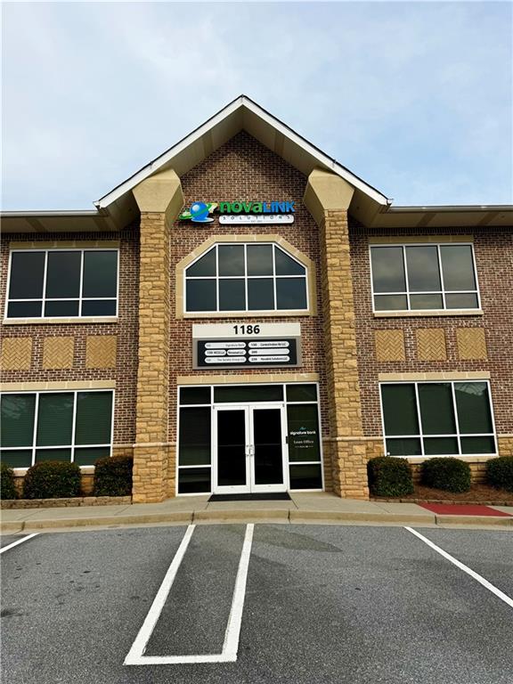Move in ready office space within the highly desirable Satellite Park at Huntcrest. It is on the second floor with 1400 square feet. The suite features a welcoming reception area, four private offices, a bar area with decorative light fixtures, and a restroom. Conveniently located on Satellite Boulevard and less than a mile from I-85 at Old Peachtree Road, this location offers excellent accessibility for both employees and visitors.