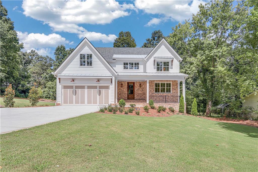 Located in Longstreet Hills, one of Gainesville's most sought-after in town residential areas, this craftsman style home is just under 6,000 square feet. Built by Canada Home Builders and designed by well-loved designer, Maggie Griffin, no detail was left undone. The main level boasts handsome hardwood floors, high ceilings, stunning light fixtures, custom trim package and entertaining spaces at every turn. Beautiful master suite with windows that welcome in the sunlight. Master bath includes marble countertops, double vanities, pocket doors, heated floors, separate soaking tub, and gorgeous shower. Chef kitchen with custom cabinetry, top of the line appliances open to large, well-appointed living room with large fireplace and access to covered porch. Upstairs, enjoy 3-bedrooms, 2 full baths, playroom, and 2nd laundry space. Step outside the back door and let the entertaining begin. Covered porch overlooks beautifully landscaped yard. Perfect spot for pool. Full unfinished basement. No HOA. Just minutes from shopping, schools, and downtown Gainesville.