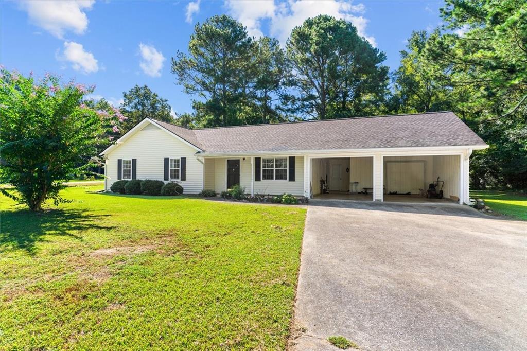 LARGE LEVEL OVERSIZED CORNER LOT - This charming single-story ranch welcomes you home with an open -concept layout and stunning vaulted ceilings that create a spacious and airy atmosphere. This 3 bedroom & 2 bathroom house has been well maintained.