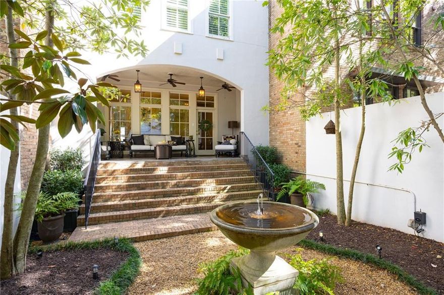 This one-of-a-kind home features a gated courtyard with Savannah charm, beautiful water fountain illuminated with landscape lighting, and a covered porch for romantic evenings. Inside, enjoy a chef’s kitchen with custom cabinetry, 6-burner stove, breakfast bar, and shiplap accents. The living room offers a fireplace with custom mantle and built-ins, while the dining room boasts floor-to-ceiling windows overlooking the courtyard. Upstairs: a luxurious master suite with spa bath, two bedrooms with full baths, and laundry. Terrace level includes a bedroom or office, full bath, large storage room, and second laundry making it perfect for multigenerational living.
Loaded with upgrades: California Closets in every room, hardwood floors, custom stair runners, and a garage with storage, workbench, granite floors, and pre-wired for EV charging. There is plenty of storage throughout the home.
Walk to Downtown Woodstock for dining, boutique shopping, live music at Northside Hospital Amphitheatre, or enjoying your favorite beverage at Starbucks or Reformation Brewery. Enjoy Greenprints Trail for walking, biking, and running, and ice skating in Adair Park. Community amenities: large gated pool, dog-friendly spaces, and a park and nature trail along the creek.
Don’t miss this rare opportunity—schedule your private tour today!