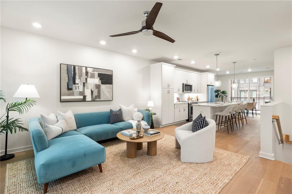 Welcome home to this wonderful newer community located directly on the Beltline in Grant Park. Experience the walkable city lifestyle with the Beacon across the street--a mixed use development with a coffee shop, restaurants, & a Sunday farmers market, plus being a few steps away from the Southside Trail to connect you to the rest of the city. 9ft ceilings and beautiful white oak floors welcome you into the main living space, seamlessly flowing from living to kitchen to dining and out to the private patio space, perfect for starting your morning. The kitchen features veined white quartz countertops, ample cabinet storage, stainless steel appliances, and lots of room for entertaining guests. The primary bedroom located on the main floor features an en-suite bath with a double vanity, glass shower, and walk-in closet. Both bedrooms have brand new carpets, and the entire home has been repainted from baseboard to ceiling. Downstairs you'll find a second bedroom with it's own bathroom, perfect for a home office or even a roommate. There's also tons of extra storage space on the lower level. This home features an ample sized garage plus one additional tandem parking space in the driveway. The community also offers a few small greenspaces for your pets. Come and find out what Grant Park has to offer!