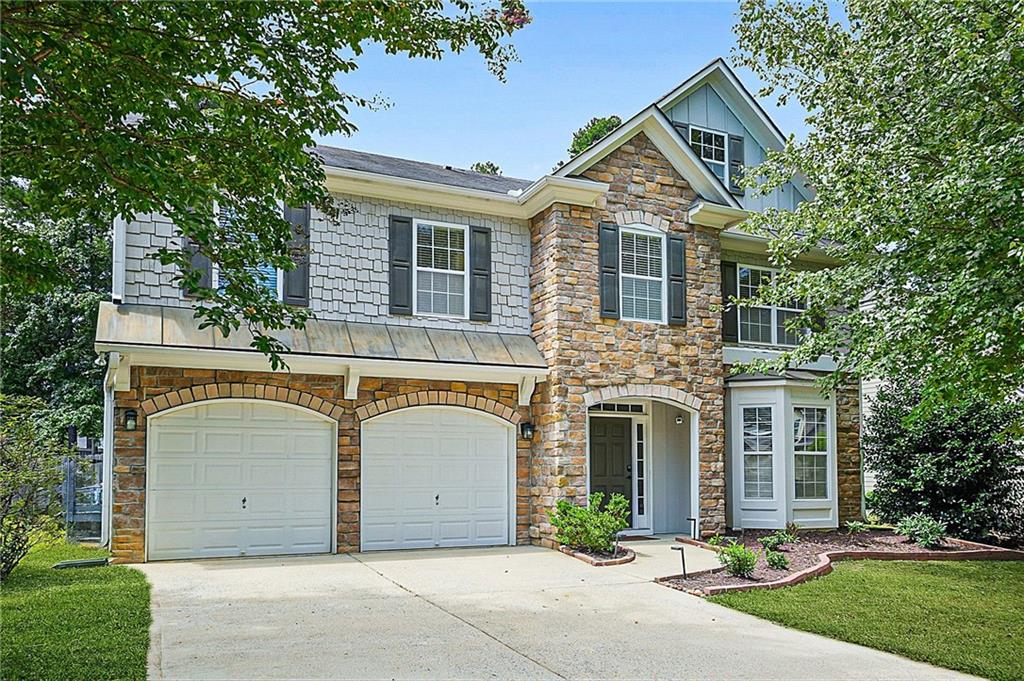 Welcome to this vibrant 2-story residence nestled in the quaint Stilesboro Ridge community. This spacious home spans over 3,000 sq ft of living space where you will find on the main level a formal living room, family room, kitchen w/ eat-in area, and a separate dining room. Upstairs you will find a versatile loft area ideal for a media room or play zone, as well as all 4 bedrooms. The Master Suite is expansive and includes a sitting area and an updated modern bathroom. Other updates throughout the home include LVP wood flooring on both levels, interior paint w/ focal point fireplace, and decorative wallpaper in half bath. Home is situated on a cul-de-sac street and has a fenced private backyard with a paved patio area. Prime location - only 3 miles to Downtown Kennesaw and 5 miles to Kennesaw Mountain! *PREFERRED CLOSING ATTORNEY: PACIFIC LAW GROUP*