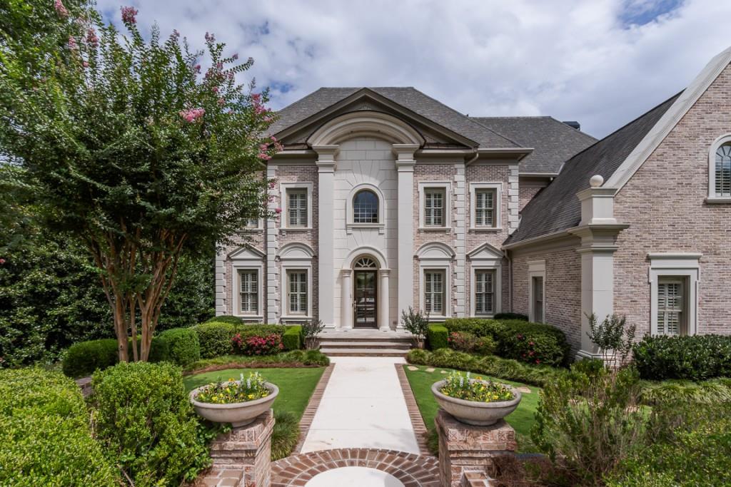 A palette of rich materials and thoughtfully considered details were incorporated into the recent renovation of this exquisite custom home located on a private cul-de-sac in sought after Tiller Walk. A superb level of finish is seen throughout the home resulting in a fresh tone of modern elegance with the use of natural stone surfaces and flooring, extensive millwork, custom lighting and numerous other designer touches. An entertainer's dream open layout flows between the large dining room with butler's pantry, impressive great room with 12 ft coffered ceiling and a curved bank of windows to the expertly appointed eat-in kitchen featuring a suite of premium appliances, marble counters, bespoke cabinetry and show-stopping vent hood. The spacious primary suite offers a large fireside sitting area, separate office, massive walk-in closet and luxuriously appointed bath complete with dual vanities, walk-in shower and separate soaking tub. The expertly finished terrace level features 12 ft ceilings, a full kitchen and bar, recreation area with access to the slate patio with outdoor fireplace and grill overlooking the heated Pebbletec pool and lush flat turf backyard.