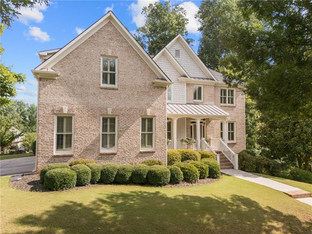 ABSOLUTELY PRISTINE AND MOVE-IN READY! This beautifully upgraded 5-bedroom, 4-bath home is located in the highly sought-after Westbrook swim/tennis community, known for its tree-lined streets and welcoming charm! Freshly painted inside this home features NEW HVAC systems, a NEW HOT WATER HEATER, and a NEWER ROOF—all major systems updated for peace of mind! The main level offers a cozy family room with soaring ceiling and fireplace, a dedicated office, formal dining room, and guest suite with a full bath. The heart of the home is the fully RENOVATED Kitchen, boasting an expansive island, Quartz counters, designer backsplash, vent hood and a custom-designed walk-in pantry—all complemented by updated lighting throughout. Just off the kitchen, enjoy your covered and screened-in porch, ideal for relaxing or entertaining year-round. Upstairs, The spa-like primary bath offers dual vanities, an oversized shower, and two private water closets—providing both luxury and functionality. You'll also love the separate his-and-hers walk-in closets, offering ample space and organization. You'll also find three spacious secondary bedrooms, two full bathrooms, a bonus/flex room, and a designer laundry room with high-end finishes. The large unfinished terrace level is ready for your personalization—perfect for future expansion. The exterior has been freshly landscaped and offers incredible curb appeal. Enjoy a 3-car side-entry garage and the privacy of a quiet cul-de-sac with green space, offering a peaceful setting and a great spot for casual gatherings with friends and neighbors. Westbrook offers resort-style amenities including a Jr. Olympic pool, lighted tennis courts, playground, clubhouse, and active social calendar. Conveniently located near the Big Creek Greenway, Cumming City Center, GA-400, shopping, dining, and top-rated Forsyth County schools, this home offers the perfect blend of luxury, comfort, and community. Don’t miss your chance to call this exceptional property home—schedule your showing today!