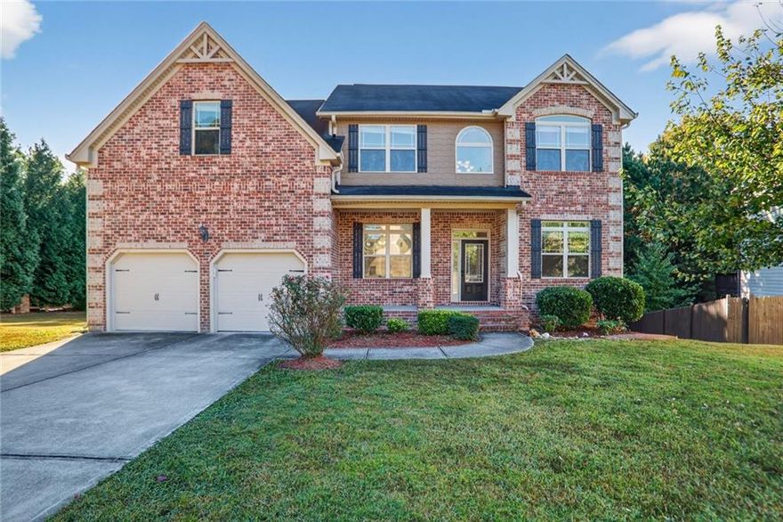 Opportunity is knocking at 5275 Jones Reserve Walk, where classic charm meets modern sophistication in this quiet pocket community in beautiful Powder Springs. Less than 10 years, this 5 Bedroom, 4 Bath residence offers over 3,100 square feet of tastefully designed living space, whether you're entertaining guests and grilling outside or settling in for a long winter weekend in front of the fireplace. Step through the front door, take off your shoes and set your things down in that large office before sitting down for dinner across the 2-story grand foyer in the formal dining room. Or pull into a 2-car garage and step right into your open concept kitchen and drop those groceries off. Take your breakfasts in a sun-drenched, eat-in kitchen that faces both your fireplace focused family room and your outdoor patio that overlooks the backyard. Speaking of, this chef's kitchen has it all: stone countertops, a large island, double ovens, gas cooktop, and a walk-in pantry. Call it a night and head to the main floor bedroom or retreat upstairs to the oversized primary suite, complete with tray ceilings, separate sitting area, and a second fireplace in front of your future California King-size bed (not included). The ensuite bathroom has, of course, dual vanities, a generous tub, separate large glass shower, and a windowed walk-in closet. Down the hall you'll find 3 additional bedrooms and 2 baths, not to mention, the convenient upper level laundry room. Need more? How about the possibilities in the unfinished walk-out basement! Already stubbed for an additional bathroom, the opportunities are endless: add a gym, a podcast set, a bedroom, or a media room or an in-law suite. Whatever you decide, you have plenty of space and light to do it and it won't even feel like a basement. Nestled on a quiet cul-de-sac, this tucked away community is minutes from restaurants, shopping and recreation, Cobb County schools, and just far enough outside the perimeter to occasionally saunter into the city to enjoy a ball game or the aquarium. Welcome home!