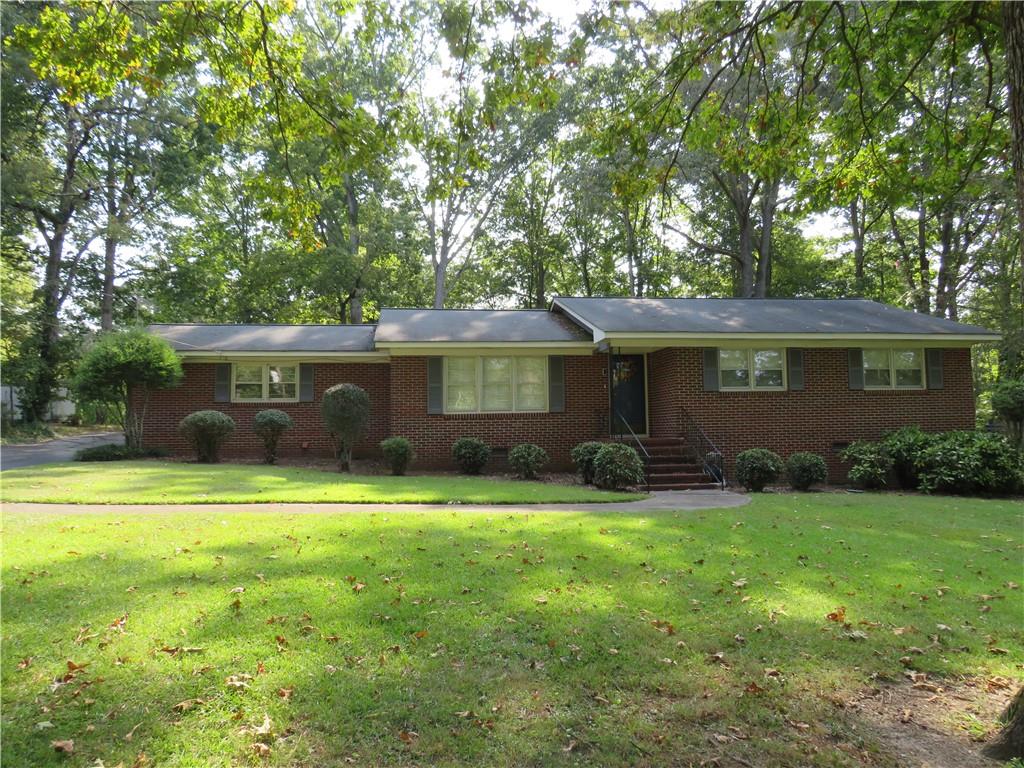 Location, location, location! This brick ranch sits in the perfect area. North end of town, convenient to Rome and Cave Spring, and downtown Cedartown. 3 bedrooms, 1.5 baths, mainly hardwood flooring, formal living and dining area, as well as den/sunroom. Private backyard with small fenced area perfect for small children or pets. Additional carport and storage building round out this great property. You do not want to miss this one!