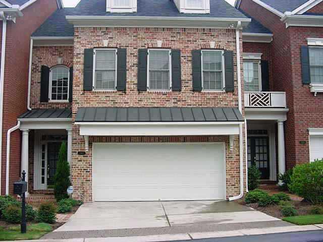 PRICE REDUCTION - LOWEST PRICE FOR ONE OF THE LARGEST UNITS. HAS HARDWOODS MAIN LEVEL, HIGH CEILINGS. LOWER LEVEL COULD BE TEEN SUITE OR IN-LAW SUITE. HAS A COVERED PORCH AND A DECK.