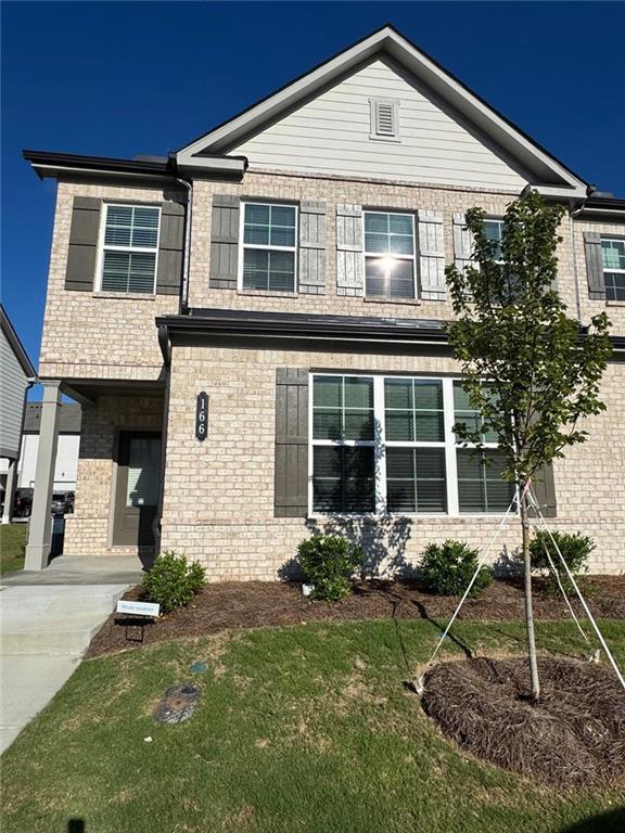 This move-in ready 3-bedroom, 2.5-bathroom spacious end-unit townhouse offers modern comfort and convenience in a prime location. The main level features an open floor plan designed for both relaxation and entertaining, with a spacious family room, dining area, and a fully equipped kitchen showcasing stylish cabinetry, expansive countertops, a large island, oversized sink, and designer lighting. A private rear patio extends the living space outdoors, creating the perfect spot to unwind. Upstairs, the owner’s suite is thoughtfully placed at the back of the home for added privacy, overlooking the backyard and complete with a walk-in closet and private bath. Two additional bedrooms are located at the front of the home with a full bathroom nearby, while a convenient laundry room completes the upper level. Abundant natural light fills the home through a wall of windows, enhancing the bright and airy feel throughout. A two-car garage provides versatile storage space, and the home includes a refrigerator, washer, and dryer for your convenience. Residences at Gateway is a vibrant, walkable community located near Barrow Crossing and downtown Winder, offering quick access to shopping, dining, and outdoor recreation at Fort Yargo State Park and The Chimneys Golf Course !!