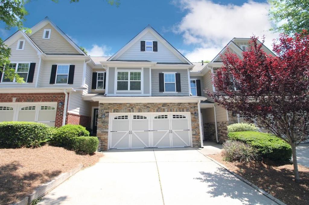 Beautiful move-in ready Townhome, conveniently located approximately 1 mile from GA400, The Collection for shopping, restaurants, and minutes from the Big Creek Greenway Trails! This home is located on a very quiet street, situated in a cul-de-sac. Wonderful spacious open concept floorplan with pretty arches, trey ceilings and a dramatic 2 story foyer entry. Lots of natural light flows through this home, making it very bright! Neutral new interior paint throughout, Water Heater was replaced in 2019. Main level has hardwoods in foyer, kitchen and dining room and half bathroom. Upper level has an awesome oversized Primary Bedroom with a separate Sitting Room or would be great for a private work space or nursery. Primary Bathroom has a double vanity, separate shower and garden tub with a large walk-in closet! HOA monthly fee includes: Exterior Maintenance includes the Roof, Swim/Tennis, Termite Bond and Landscaping. Enjoy your morning coffee on the very private patio viewing a beautiful wooded area! 2 Car Garage with two shelving units in ceiling for extra storage. Top Rated Forsyth County Schools!