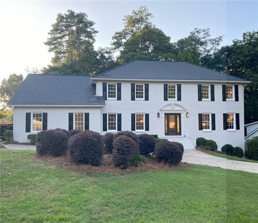 Some homes simply feel like love at first sight. And this traditional 4-sided brick beauty in Sandy Springs is one of them. Perfectly situated near the Chattahoochee River and all the amenities you could ever want, this is where timeless design meets an enviable lifestyle.
From the moment you step inside the grand marble-floored foyer, the story begins. The graceful crown molding, wainscoting, and plantation shutters whisper elegance, while the formal living and dining rooms set the scene for future holiday toasts, laughter, and candlelit dinners.
The kitchen, with its abundance of cabinetry, sprawling counters, and a cheerful writing desk, is where love notes, recipes, and Saturday morning pancakes will live on for years to come. Just beyond, the cozy family room, with its inviting fireplace, built-in bookshelves, and beamed ceilings, calls you to gather close and stay a while.
Upstairs, the primary suite is the retreat every heart craves: dual vanities, a soaking tub, and a step-in shower create a spa-like sanctuary. A bonus room above the garage, complete with its own bath, is waiting to become the perfect guest suite, game room, or creative space.
Step outside and you’ll find a covered deck for quiet mornings with coffee and an open deck for summer nights spent grilling under the stars. The basement, with its boat door and endless storage, makes room for all the adventures you’ll embark on.
But this love story wouldn’t be complete without the setting. Nestled just minutes from I-285 and GA-400, you’re only minutes from City Springs, Whole Foods, Trader Joe’s, amazing dining, local parks, and winding nature trails. The Chattahoochee River, with its peaceful beauty, is practically your backyard.
This isn’t just a house. It’s the start of your next chapter. Will you write your love story here?