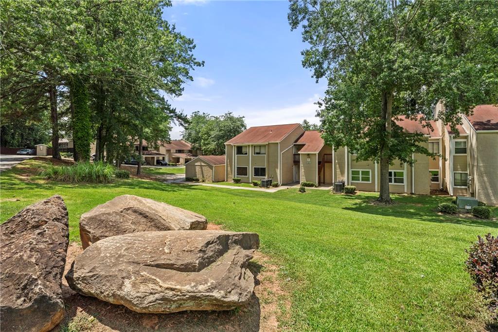 Spacious 4BR 2 Bathroom condo. Large living area with decorative "fireplace" and nook that could be used as wet bar or additional storage close to entry. Large dining area with room for a six-chair table. Walk out patio with French doors. Fresh paint and blinds throughout, screened/security entry doors on patio and entry. All stainless refrigerator, range and dishwasher included, central Air. 4 large bedrooms each with overhead lighting all large enough for a king-sized bed,
separate laundry room with extra space for storage. Security system is installed. Large, covered patio. Master includes walk in closet, sink/vanity area separate from toilet and shower. GREAT INVESTMENT PROPERTY. No leasing restrictions. Association is active and working on major improvements continually.