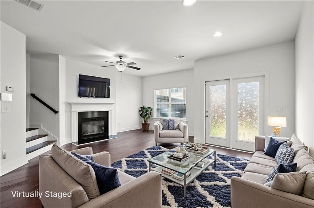 This beautifully designed townhome offers an abundance of natural light throughout its open concept floor plan. The home features 3 bedrooms, 2.5 bathrooms, a 1-car garage, and a driveway accommodating up to 2 cars. The interior boasts elegant stone countertops, a gorgeous designer backsplash, stunning dark cabinets with silver accents, and stainless steel appliances. Enjoy the convenience of an included washer and dryer on the top level. The master bath is a luxurious retreat with a separate tub and shower, double vanity, and a spacious walk-in closet. The additional bedrooms are generously sized. This home is ALL HARDWOOD FLOORING, adding to its charm and easy maintenance. The fully fenced yard is perfect for entertaining, and lawn care is maintained by the HOA. Located in a beautiful new community in Stonecrest, you’ll be near shopping, grocery stores, Stone Mountain, and I-20. Plus, the home is right across the street from Redan Recreation Center. Don’t miss out on this stunning rental opportunity!