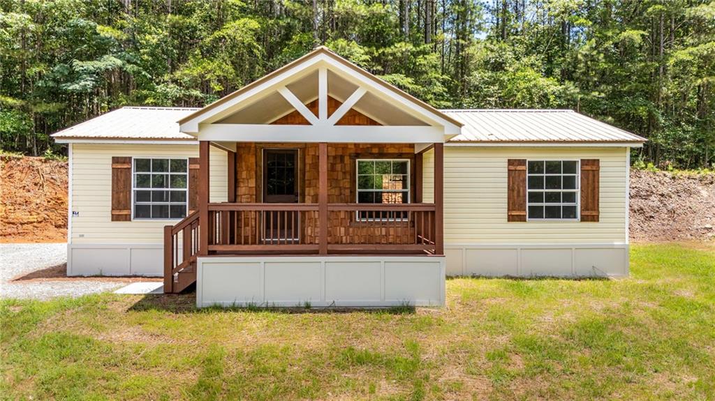 SELLER WILL PAY $5,000 towards closing costs with their preferred lender! FHA / CONV / VA and interest rate buy down available!
Charming Renovated 2 Bed / 2 Bath Mobile Home with  permanent foundation on .84 acres in Fairmount, GA!
Welcome to your perfect blend of peaceful country living and modern convenience! This beautifully renovated 2001 mobile home offers 2 spacious bedrooms, 2 full bathrooms, and sits on a generous .84-acre lot with no HOA or restrictions—giving you the freedom to make it your own!
With approximately 980 sq ft of thoughtfully updated living space, this home is ideal for first-time buyers, owner-occupants, or investors looking for a great rental opportunity. Step inside to find a light and airy open floor plan featuring new LVP flooring throughout, fresh interior paint, modern trim and fixtures, stylish tile work, and a custom backsplash in the kitchen.
The large living room flows seamlessly into the kitchen, creating an inviting space for entertaining or relaxing. Both bedrooms offer their own private bathrooms, providing comfort and privacy for family or guests. A separate laundry room adds convenience to daily living.
Enjoy your morning coffee on the covered 14x8 front porch, or step out to the 4x5 back stoop and take in the beautiful open yard—perfect for gardening, outdoor activities, or future expansions.
Located in Fairmount, Georgia, this home offers the best of both worlds: tucked away in the quiet countryside, yet conveniently positioned between Highways 75 and 515 for easy access to shopping, dining, and travel.
Don’t miss this move-in ready gem—schedule your showing today and explore all the possibilities this wonderful property has to offer!
