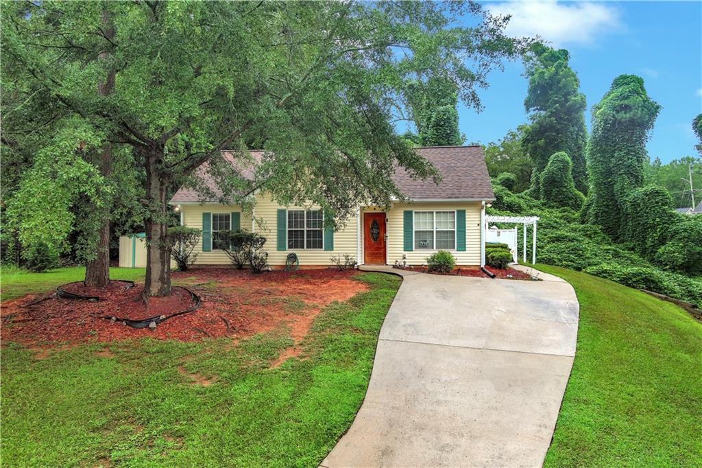 Come see this charming 3-bedroom, 2-bathroom ranch-style home in Winder, GA. Built in 1999, this move-in-ready residence offers 1,079 square feet and sits on a 0.25-acre lot at the end of a quiet cul-de-sac in the desirable Nicholas Pointe subdivision. The modern kitchen has stainless steel appliances, granite countertops, white cabinetry, and sleek new tile flooring. The primary suite features a tray ceiling and double closets, while the secondary bedrooms provide ample closet space, ideal for family, guests, or a home office. Durable laminate flooring with a warm hardwood look flows throughout, ensuring low-maintenance living. With a roof replaced just one year ago and major appliances only two years old, this home offers added peace of mind. Step outside to a tranquil backyard, perfect for relaxing or entertaining. Don't miss the opportunity to own this well-maintained gem in a prime location, close to Winder's schools, shopping, and dining.